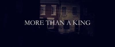 a dark picture with the words more than a king