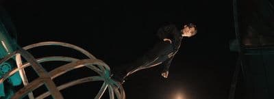 a statue of a man on top of a metal object