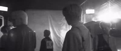a group of people standing in a room
