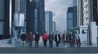 a group of young men walking down a city street