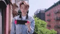 a woman holding a pink and black cell phone