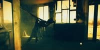 a woman is holding a sword in a dark room