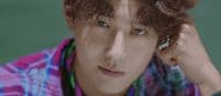 a close up of a person with curly hair