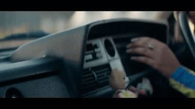 a close up of a person driving a car
