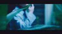 a blurry photo of a person holding a plant