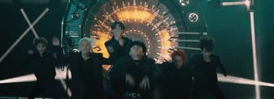 a group of people standing around each other