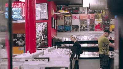 a man and a woman standing in a store