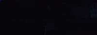 a blurry photo of a person in a dark room