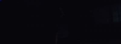a blurry photo of a person in a dark room