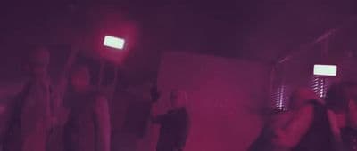 a group of people standing in a room