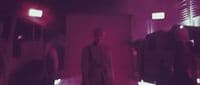 a group of people standing in a room