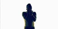 a silhouette of a woman covering her face with her hands
