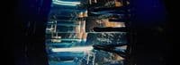 a close up of a metal object with a blue background