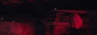 a blurry image of a person standing in the dark