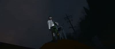 a man standing on top of a hill at night
