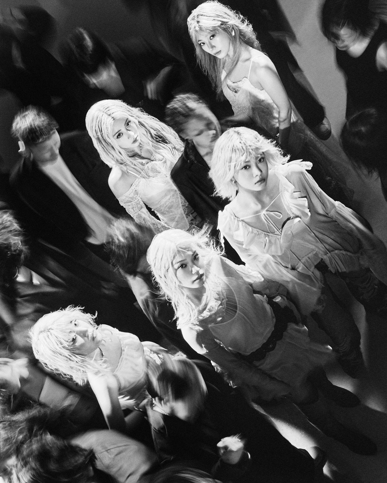 a group of women standing next to each other