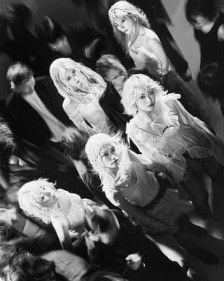 a group of women standing next to each other
