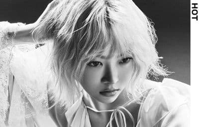a black and white photo of a woman with blonde hair