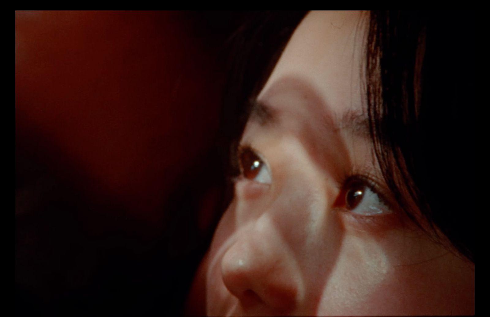 a close up of a person's face with a blurry background