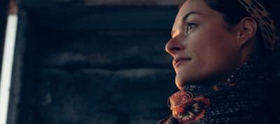 a woman with a scarf around her neck