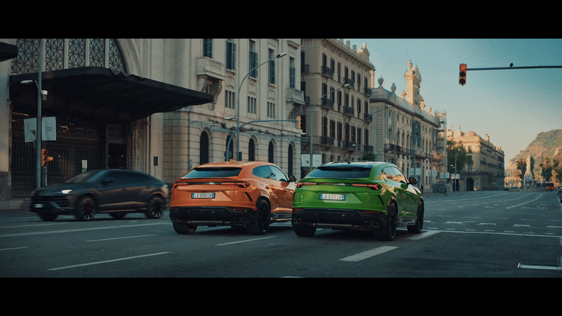 a couple of cars that are sitting in the street