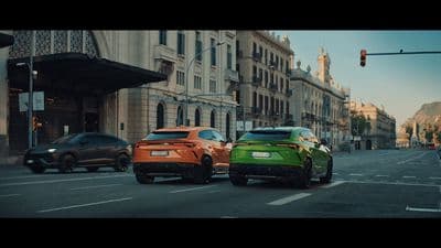 a couple of cars that are sitting in the street