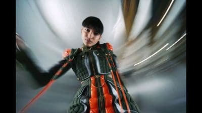 a man in a green and orange costume