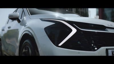 a close up of the front of a white car
