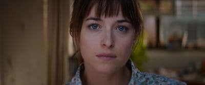 a close up of a person with blue eyes