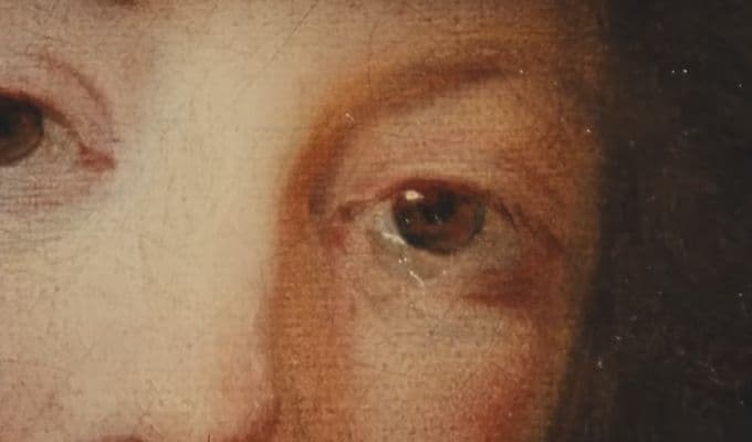 a close up of a painting of a woman's face