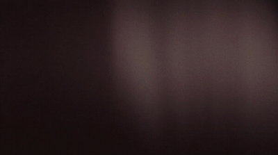 a black and white photo of a dark room
