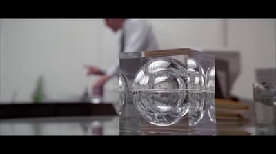 a clear glass object sitting on top of a table
