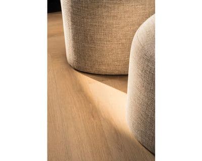a close up of a wooden floor with a chair