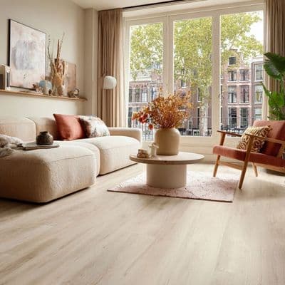 a living room filled with furniture and a large window