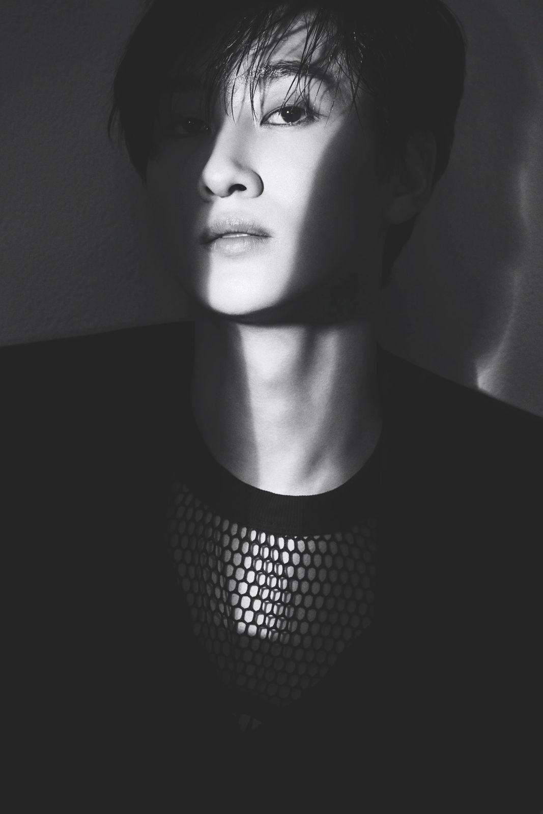 a person with a black shirt and a black and white photo