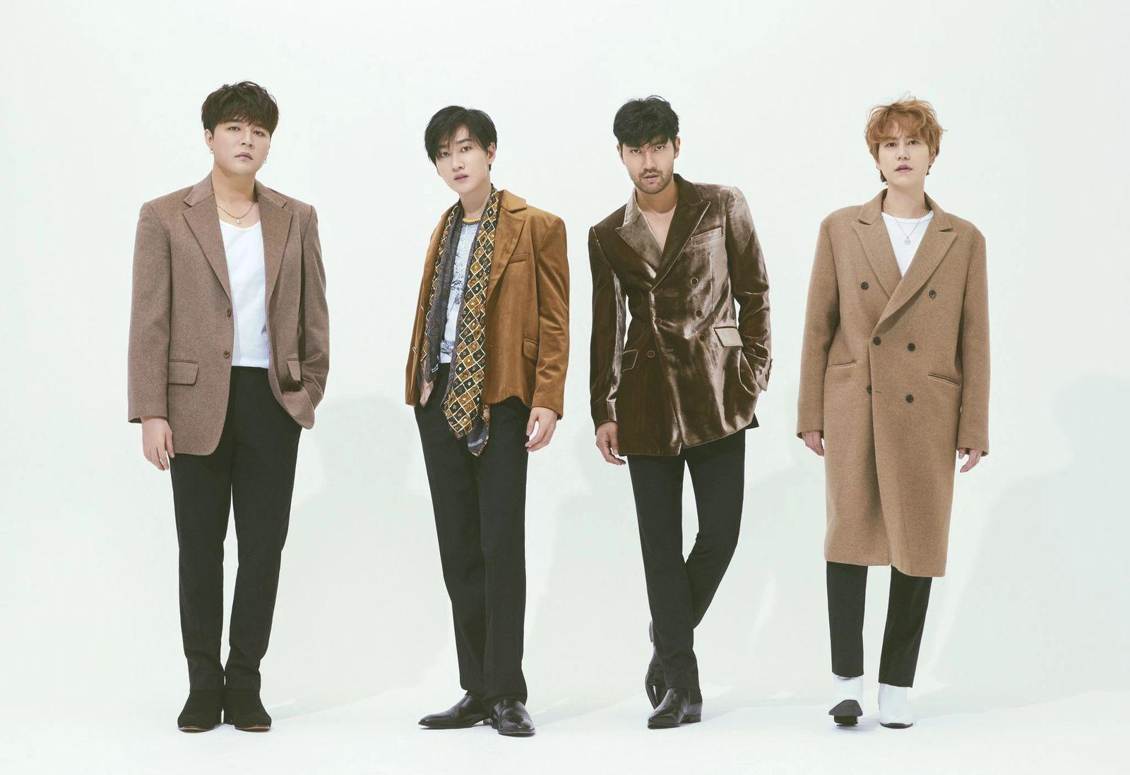 a group of young men standing next to each other