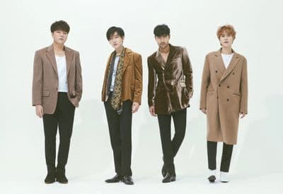 a group of young men standing next to each other