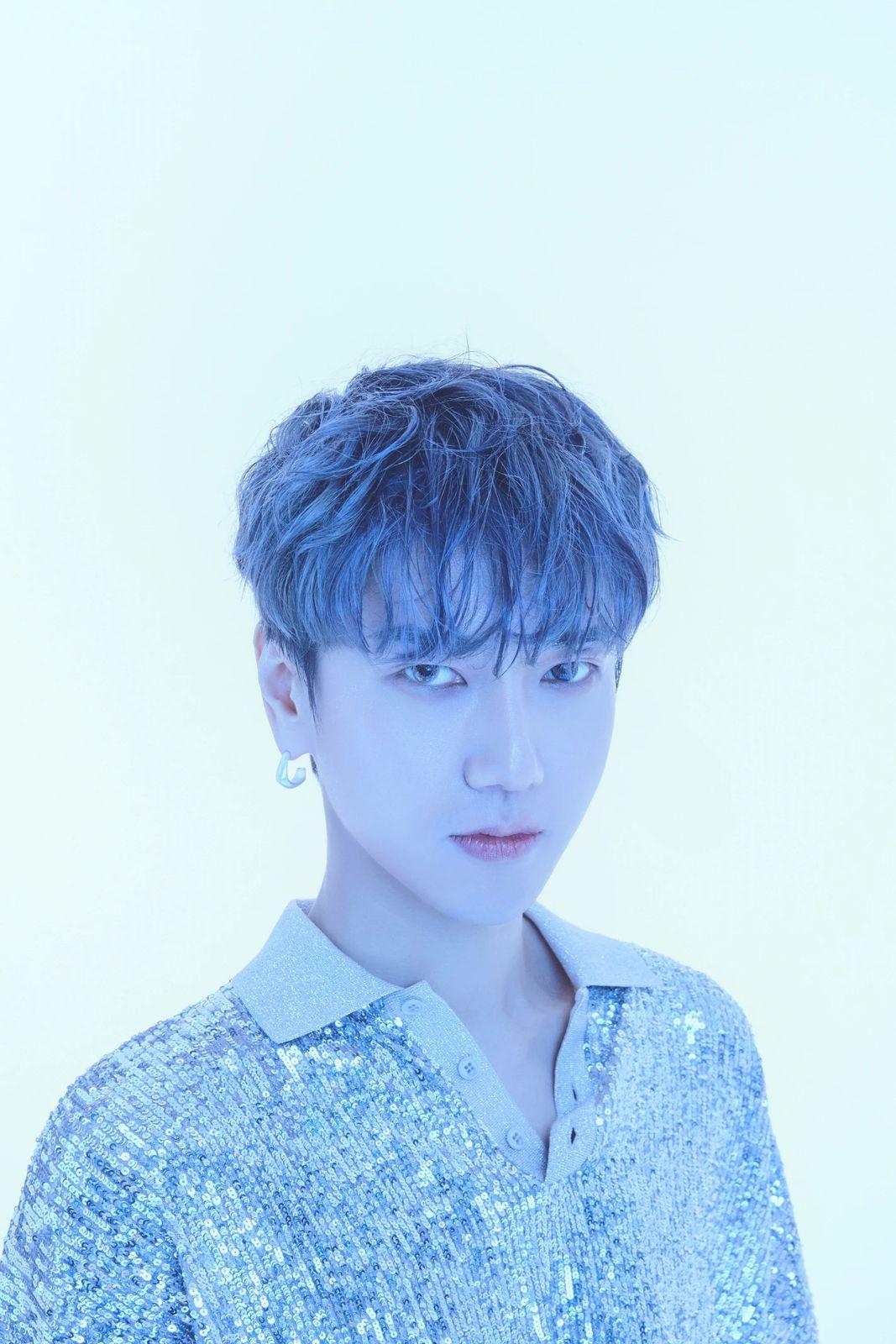 a person with blue hair and a white shirt