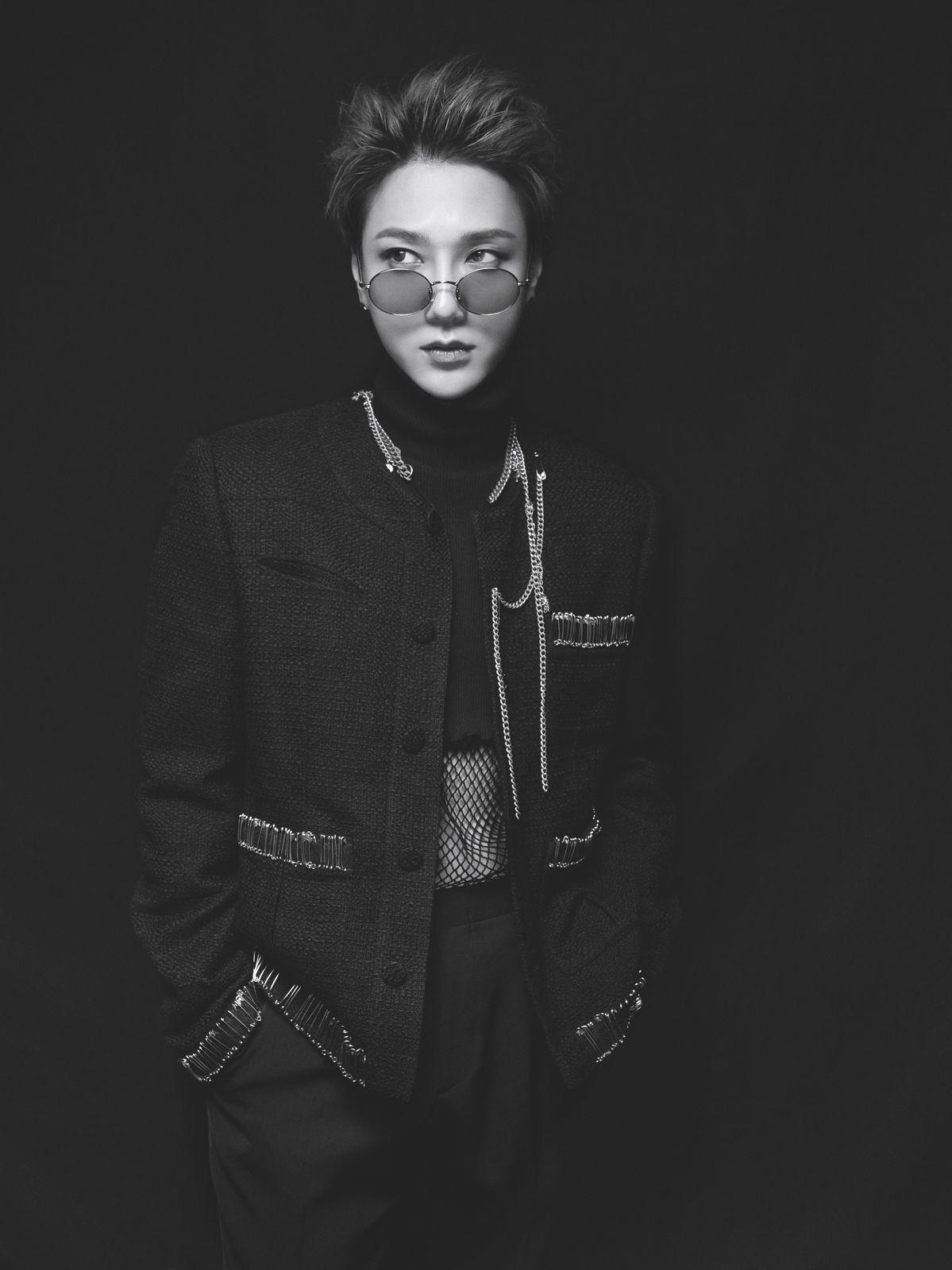 a man in a black jacket and sunglasses