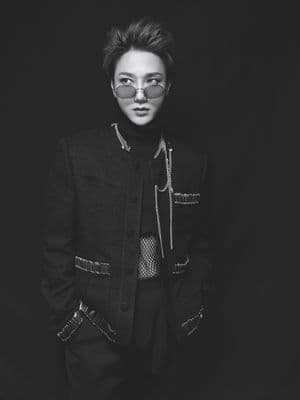 a man in a black jacket and sunglasses