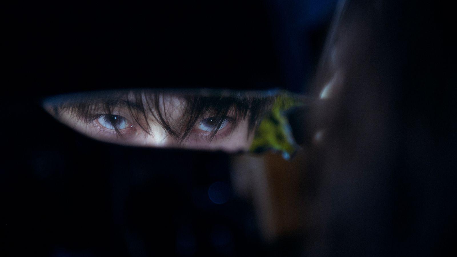 a close up of a person's face in a mirror