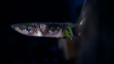 a close up of a person's face in a mirror
