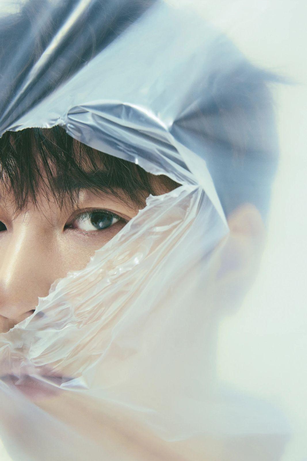 a woman with a plastic bag over her head