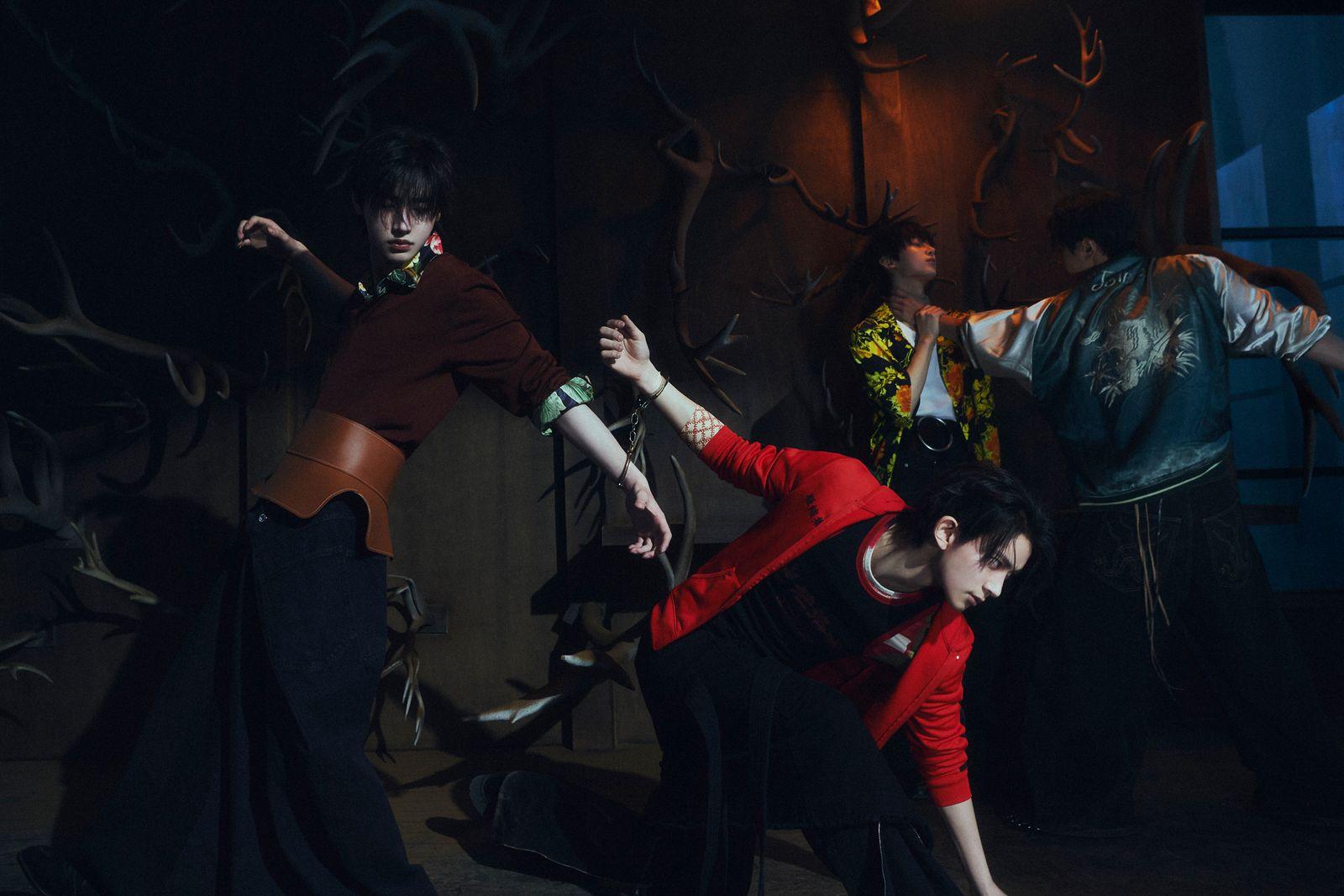 a group of people dancing in a dark room
