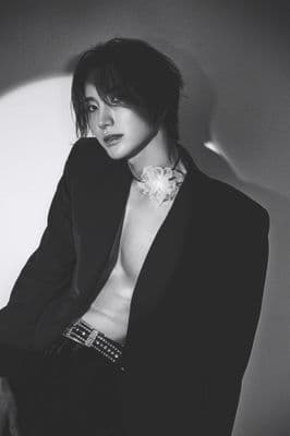 a black and white photo of a shirtless woman