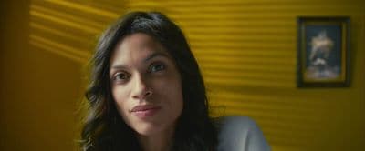 a woman with long black hair and blue eyes