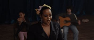 a woman with a flower in her hair