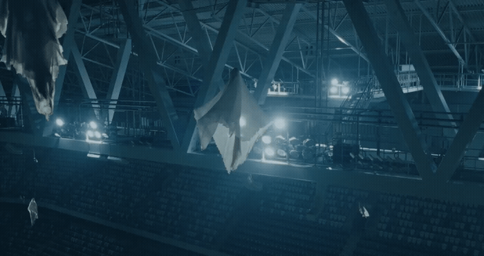 a group of umbrellas hanging from the ceiling of a building