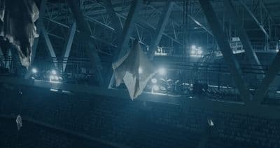 a group of umbrellas hanging from the ceiling of a building