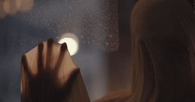 a close up of a person holding an umbrella